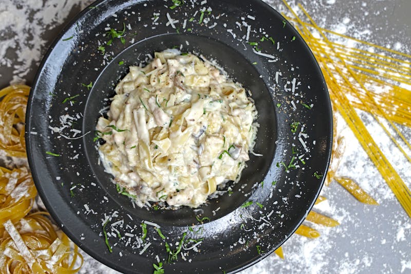 Creamy chicken alfredo fettuccine with parmesan and herbs