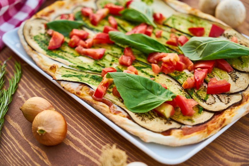 Small 10-inch custom pizza on wooden board